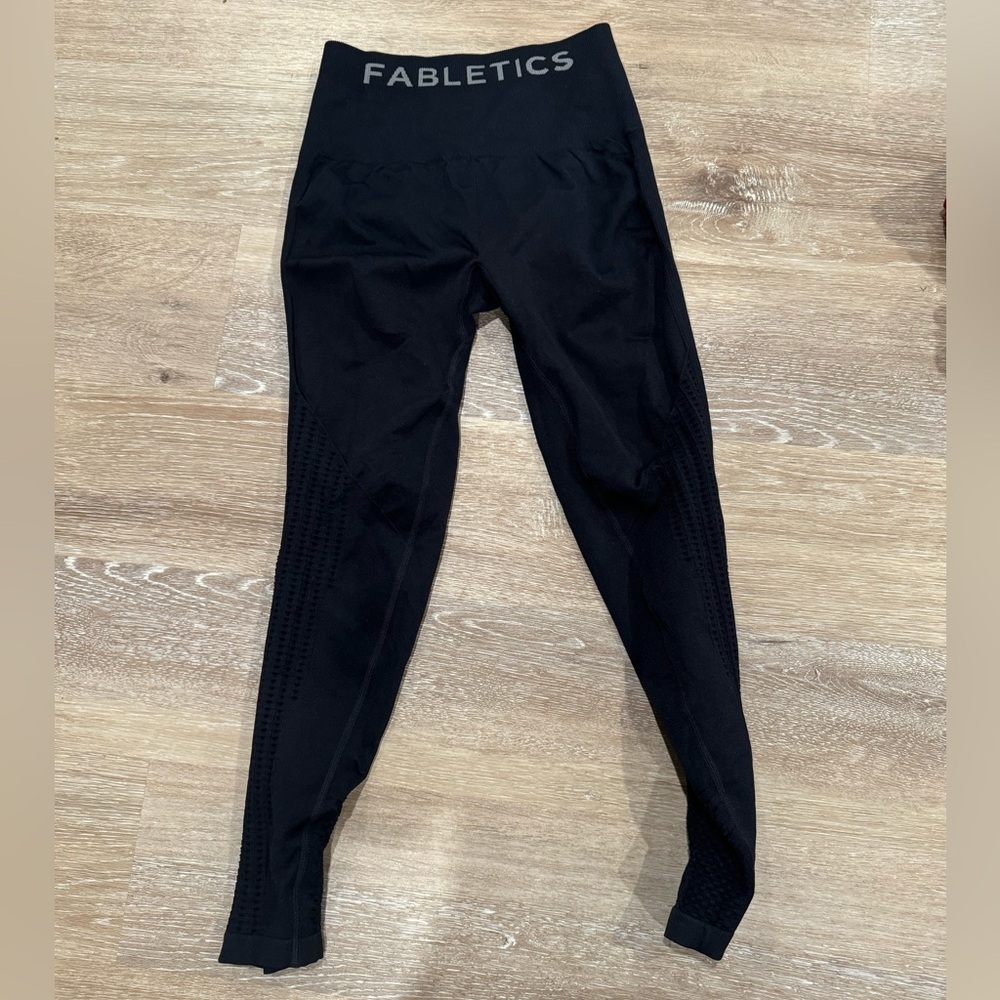 Black Fabletics leggings with see through detail on legs